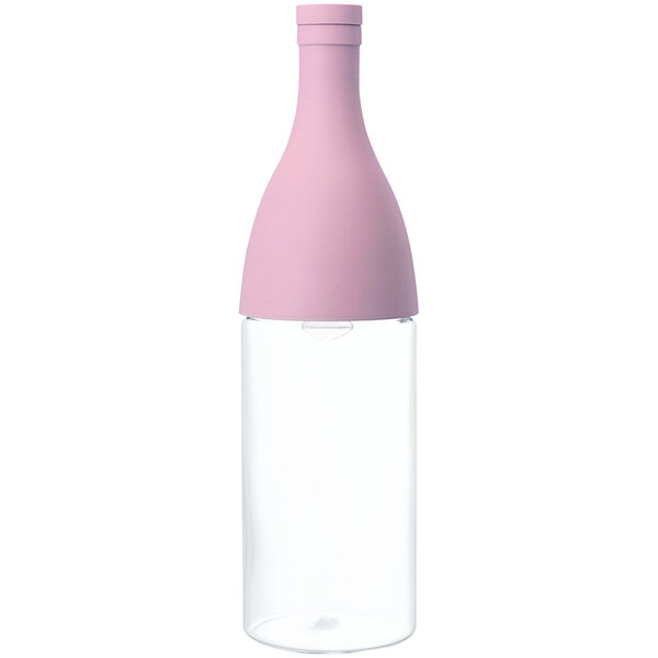 A pink glass bottle with a white cap.