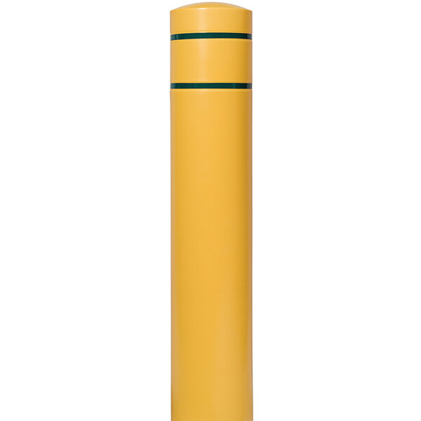 A yellow cylindrical object with green stripes.