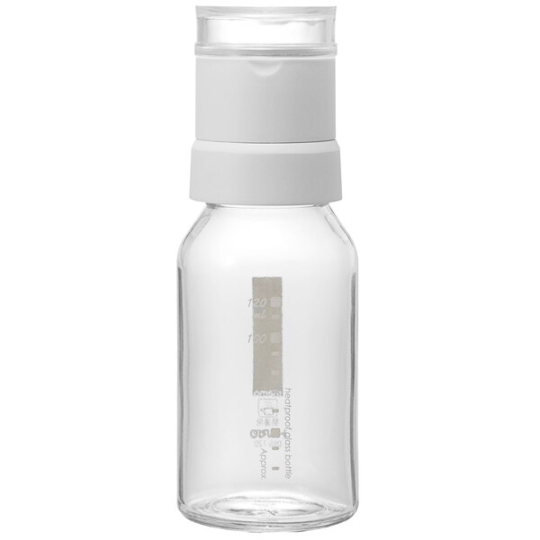 A clear glass container with a white cap.