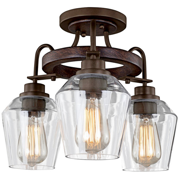A Kalco Allegheny 3-light semi-flush mount light with clear glass.
