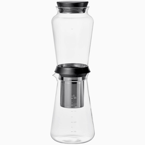 A clear glass Hario cold brew coffee maker with a black lid.