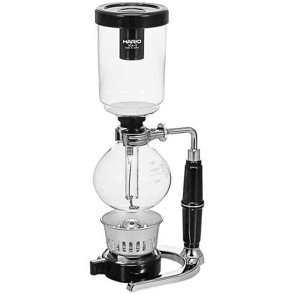 A Hario Technica coffee syphon on a glass and metal stand.