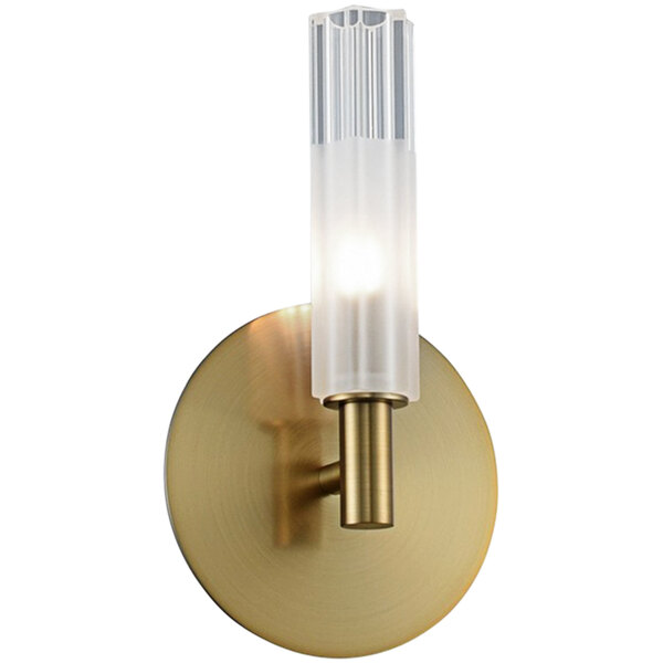 A Kalco Lorne LED wall sconce with a clear glass tube on a brass wall.