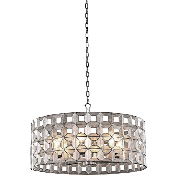 A Kalco Prado metal chandelier with a circular design and square patterns hanging in a restaurant dining area.