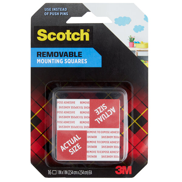 A package of 3M Scotch double-sided removable mounting squares on a table.