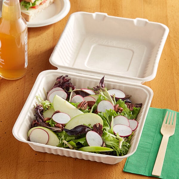 A salad in an EcoChoice natural bagasse take-out container.