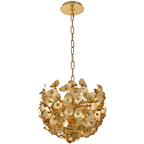 A Kalco gold chandelier with large flower designs hanging from a chain in a restaurant dining area.