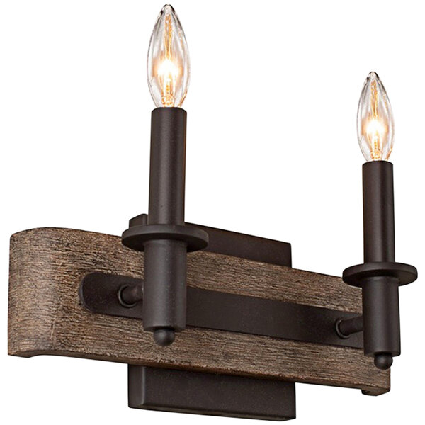 A Kalco two light wood and metal wall sconce with a bronze finish.