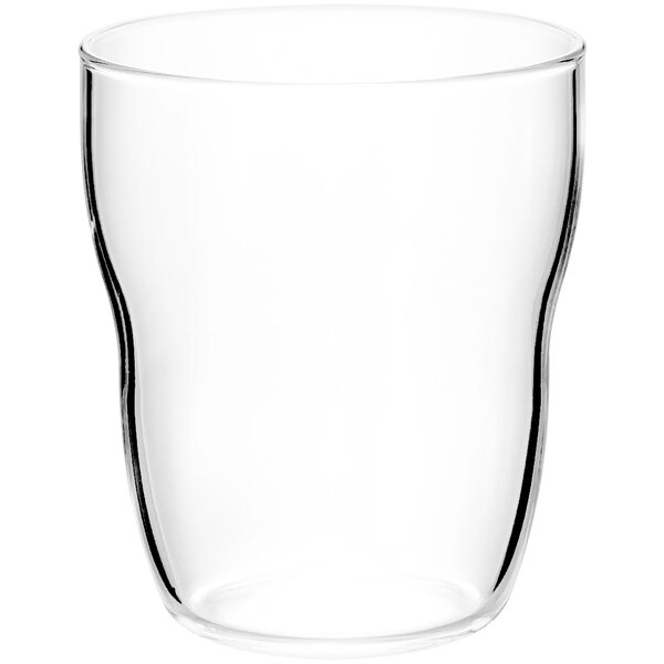 A clear glass tumbler with a white rim.