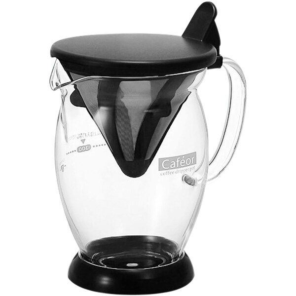A glass pitcher with a black lid and a black handle.
