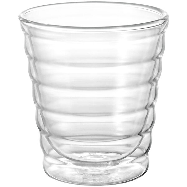 A clear glass cup with wavy lines.