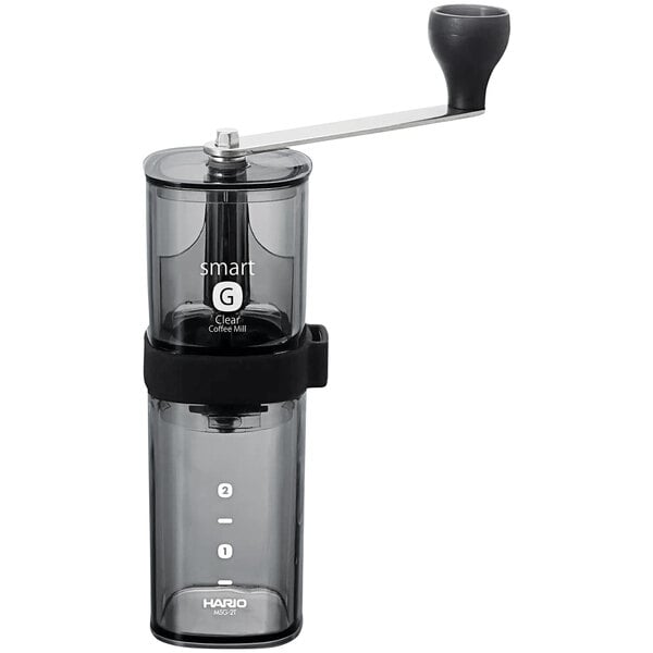 A Hario manual coffee mill with a black handle.