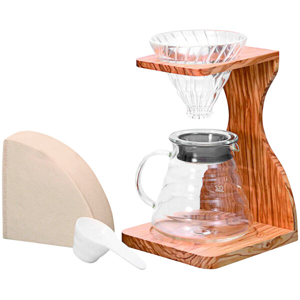 A Hario V60 coffee maker with a wooden stand and a glass server with a lid on it.