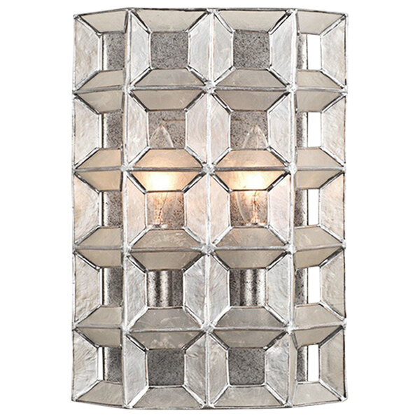 A Kalco Prado wall sconce with oxidized silver leaf finish and glass panel.