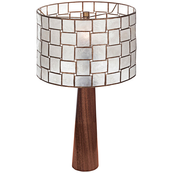 A Kalco Roxy table lamp with an oxidized gold leaf base and white mosaic patterned shade.
