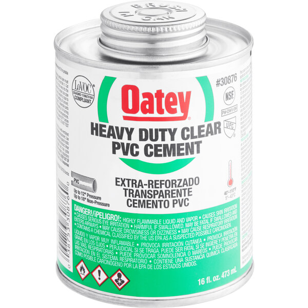 A white can of Oatey heavy duty clear PVC cement with a green label.