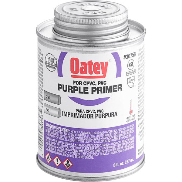 A can of Oatey purple primer with a purple label.