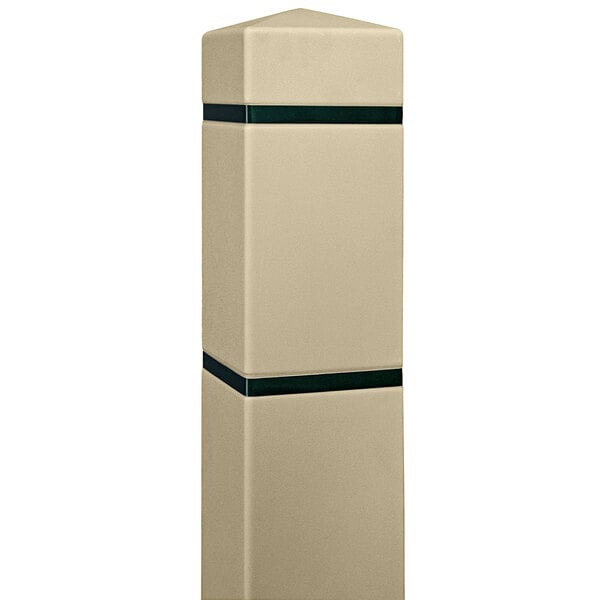 A white bollard with tan and black stripes and a green stripe.