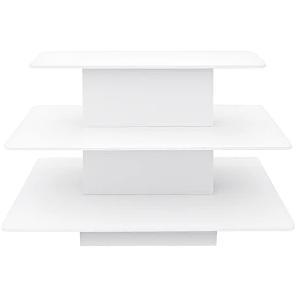A rectangular white melamine display table with three tiers.