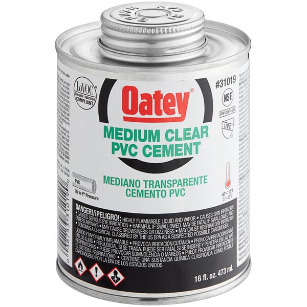 A can of Oatey medium clear PVC cement with a white label.