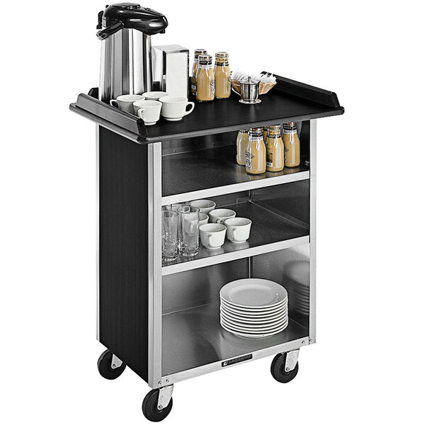 A Lakeside stainless steel beverage service cart with black vinyl shelves holding cups and plates.