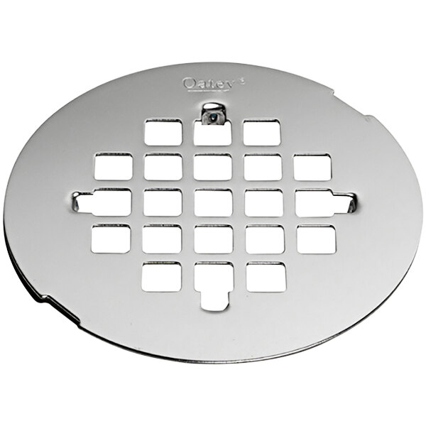 A silver circular Oatey Snap-Tite stainless steel drain strainer with holes.