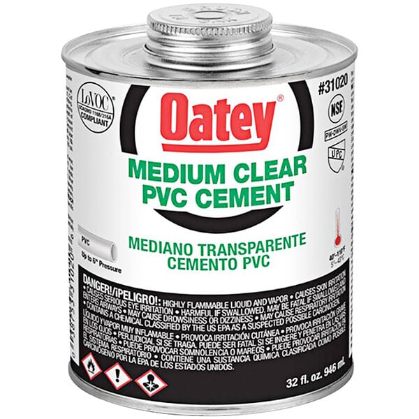 A can of Oatey medium clear PVC cement with a black and white label.