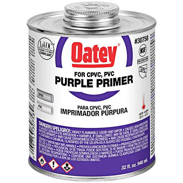 A 32 oz. can of Oatey purple primer for PVC and CPVC pipe with a purple label.
