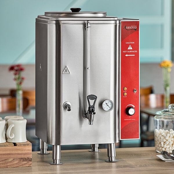 An Avantco stainless steel hot water dispenser on a table.