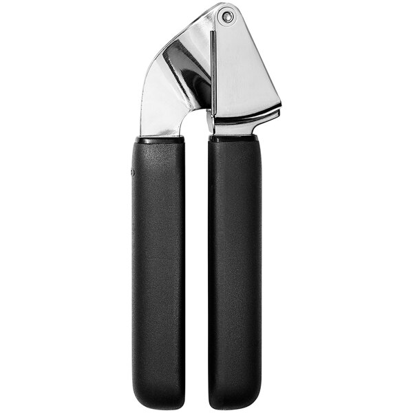 A close-up of an OXO Good Grips garlic press with black handles.