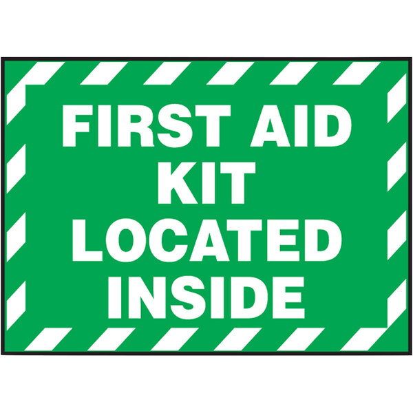 A green and white Accuform safety label with white text reading "First Aid Kit Located Inside"