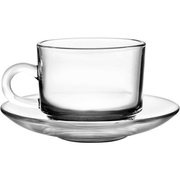 A clear glass Stack tea cup and saucer.