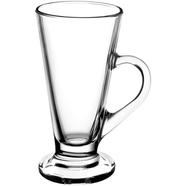 A clear glass Kenya Irish coffee mug with a handle.