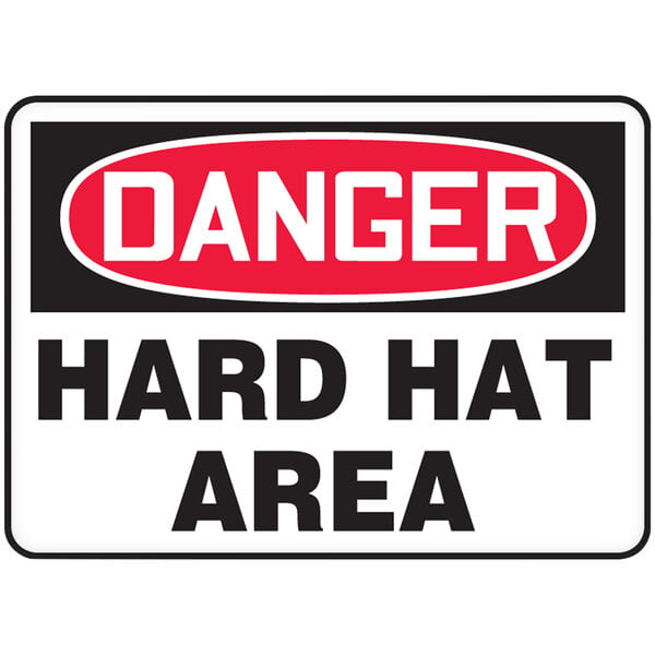 An Accuform warehouse sign that says "Danger / Hard Hat Area" in a red and black rectangle with white text.