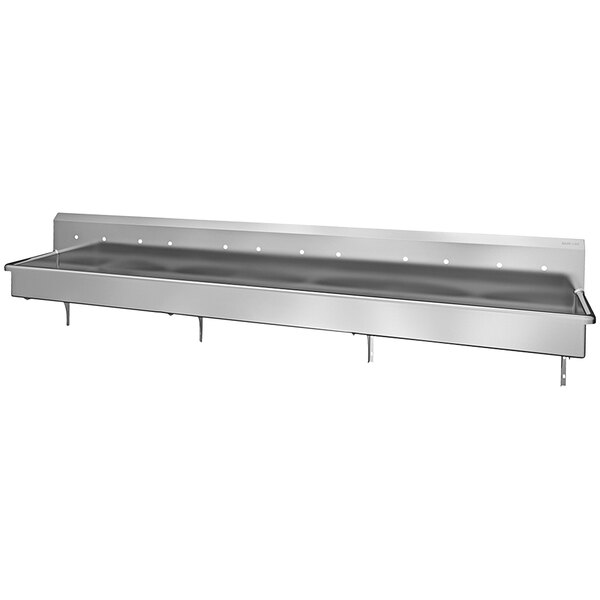 A stainless steel multi-station wall mounted utility sink with a shelf with holes.