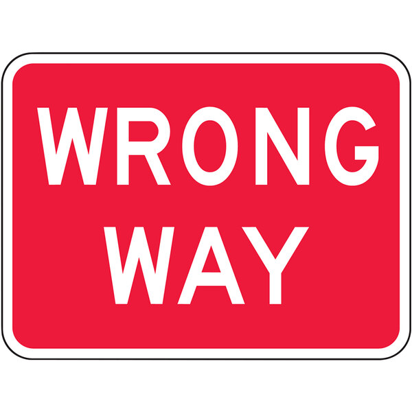 An Accuform 18" x 24" red and white reflective aluminum sign with white text that says "Wrong Way"
