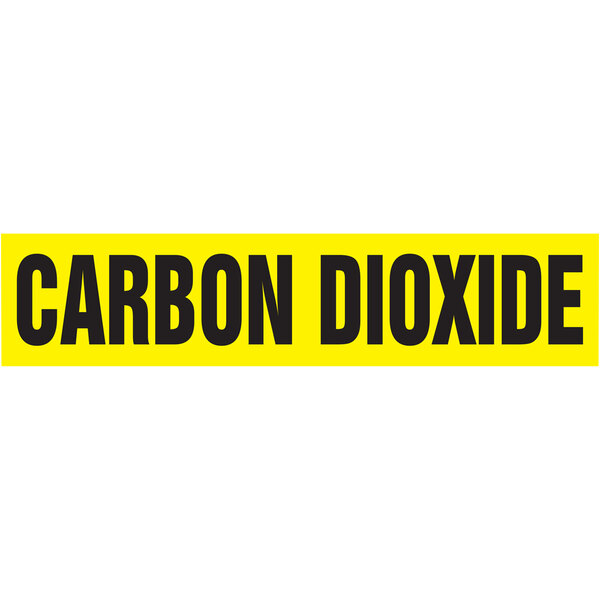 A yellow rectangular Accuform pipe marker with black text reading "Carbon Dioxide" and "Self-Stick" on a white background.