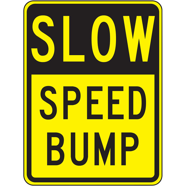 A white rectangular Accuform parking lot sign with yellow and black text that says "Slow Speed Bump"