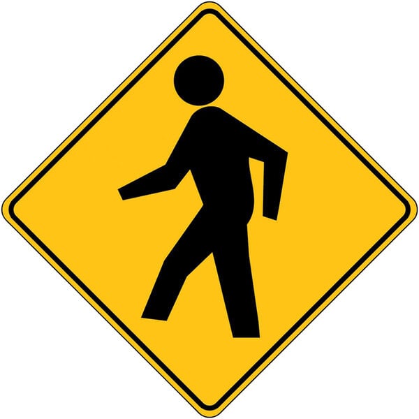 A yellow and black Accuform pedestrian crossing sign with a black silhouette of a man walking.