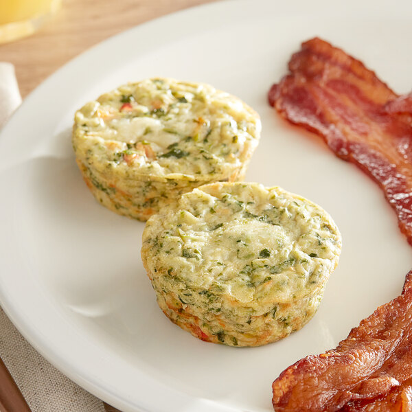 A plate with two Veggies Made Great Egg White and Spinach Frittatas.