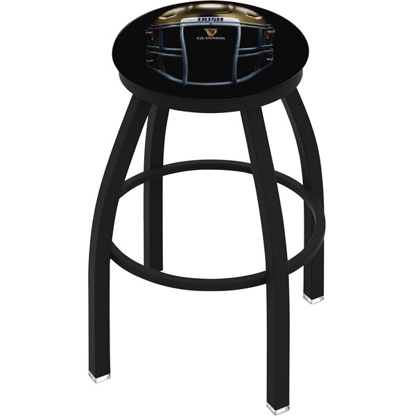 A black Holland Bar Stool with a blue padded seat and a Notre Dame football helmet on it.