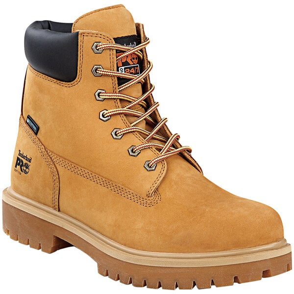 A pair of men's wheat Timberland Pro steel toe work boots with black laces and a black sole.