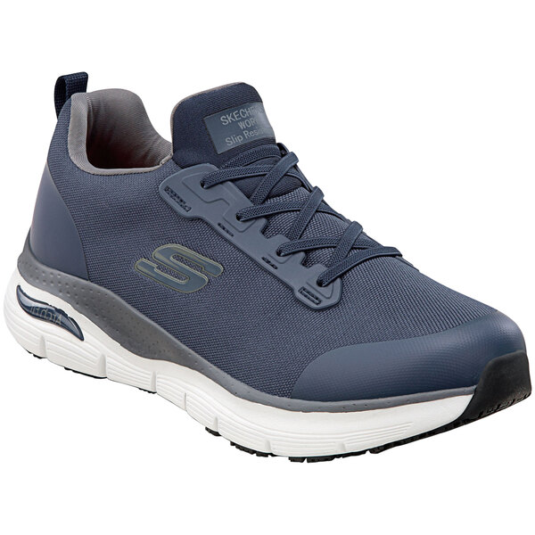 A close up of a navy Skechers Work Jake non-slip athletic shoe.