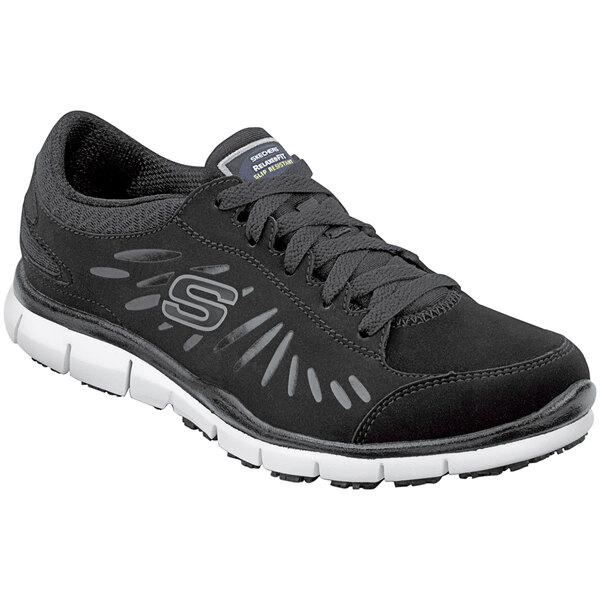 A black Skechers work shoe with a white sole.
