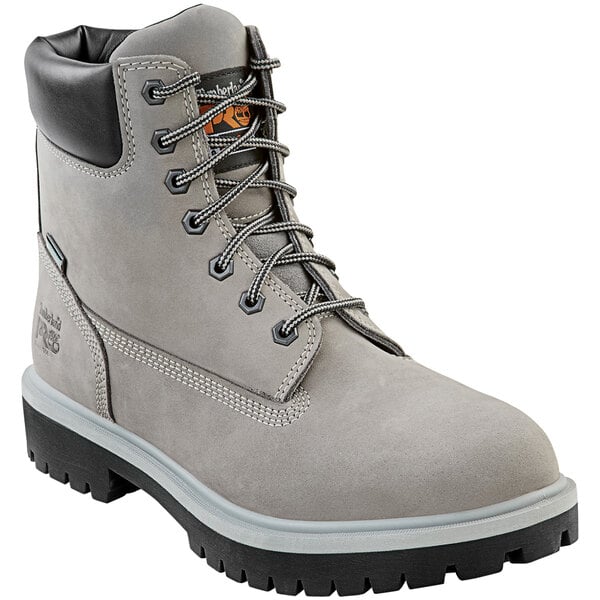 A pair of men's Timberland PRO steel toe leather boots in gray with a black sole.