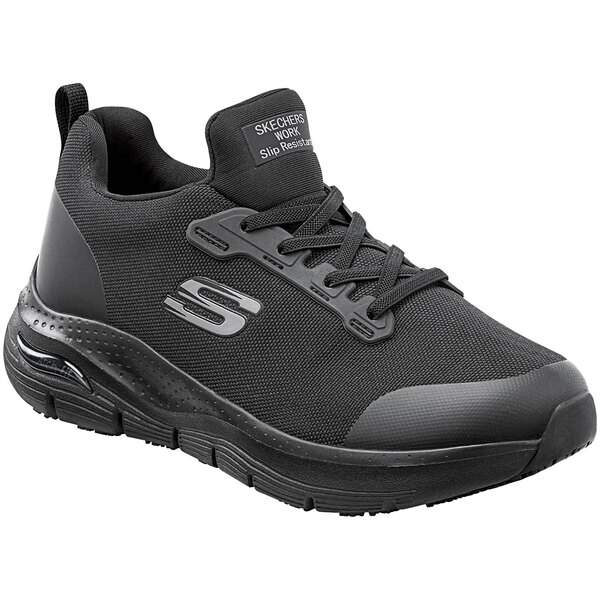 A black Skechers Leslie Arch Fit athletic shoe with white text on the side.