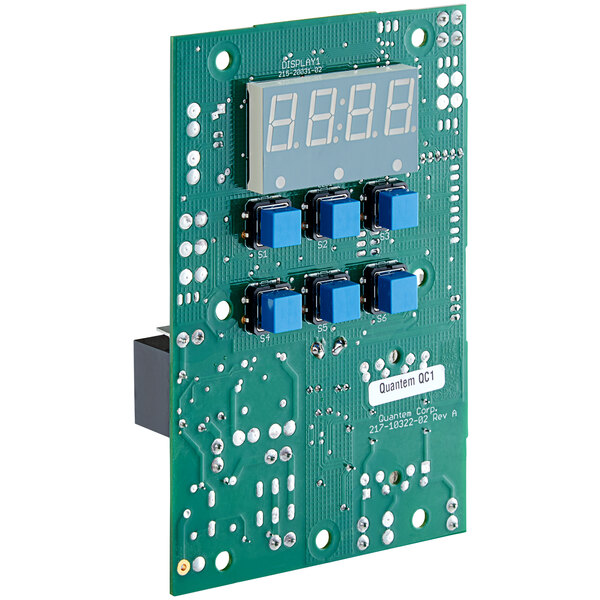 A close-up of a green AccuTemp circuit board with blue buttons and a digital display.