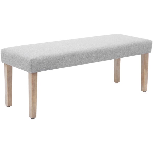 A Boss gray poly-linen weave bench with wooden legs.