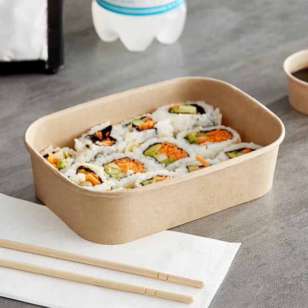 A rectangular kraft paper take-out container filled with sushi.