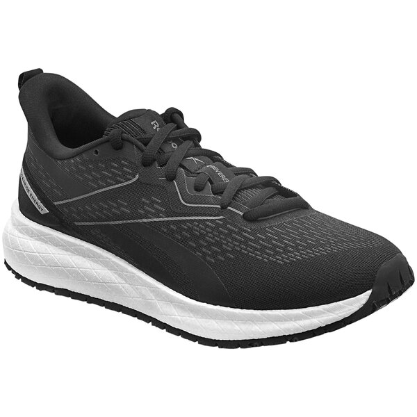A black and white Reebok Work athletic shoe with a white sole.